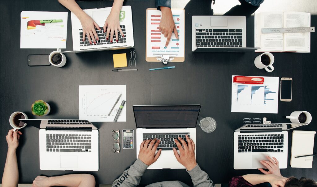 A team meeting around technology tools